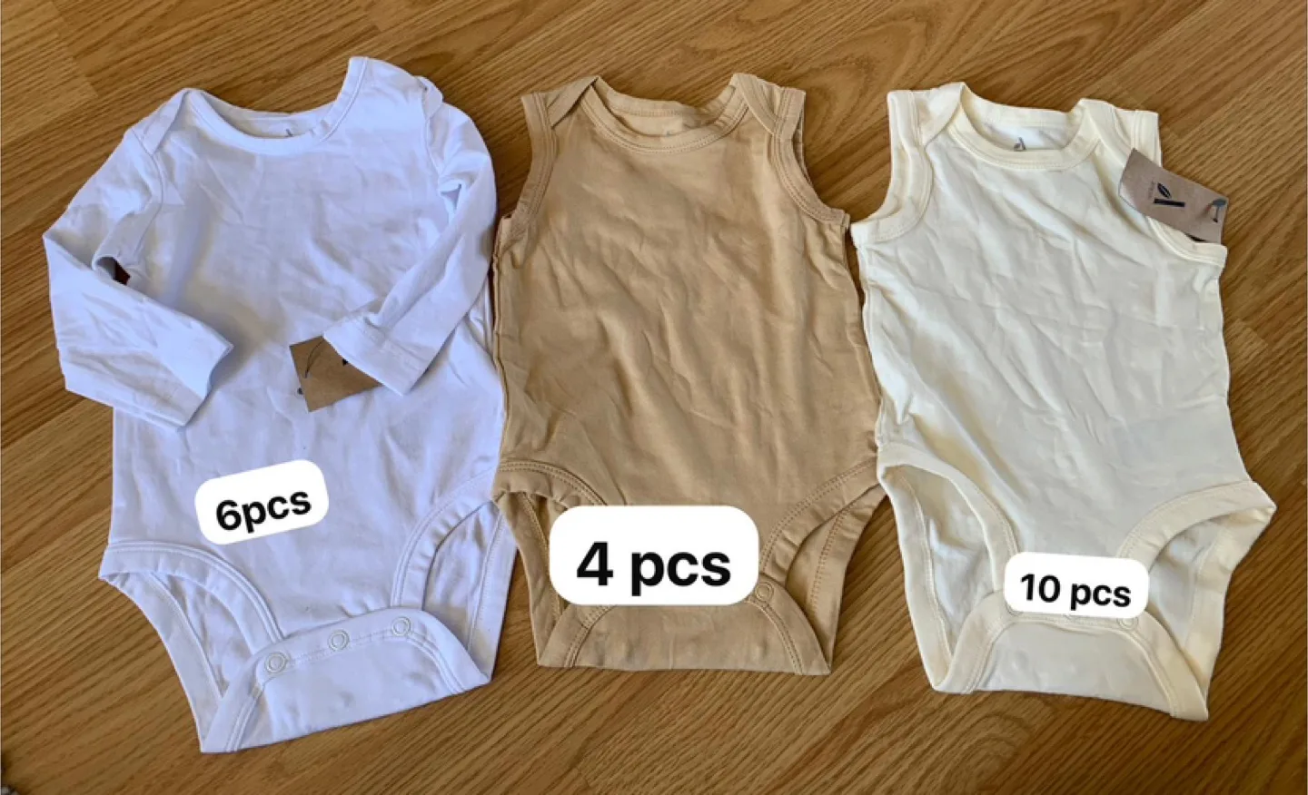 Three Baby Bodysuits - White, Beige, and Cream - 9 Months image indicator(6)
