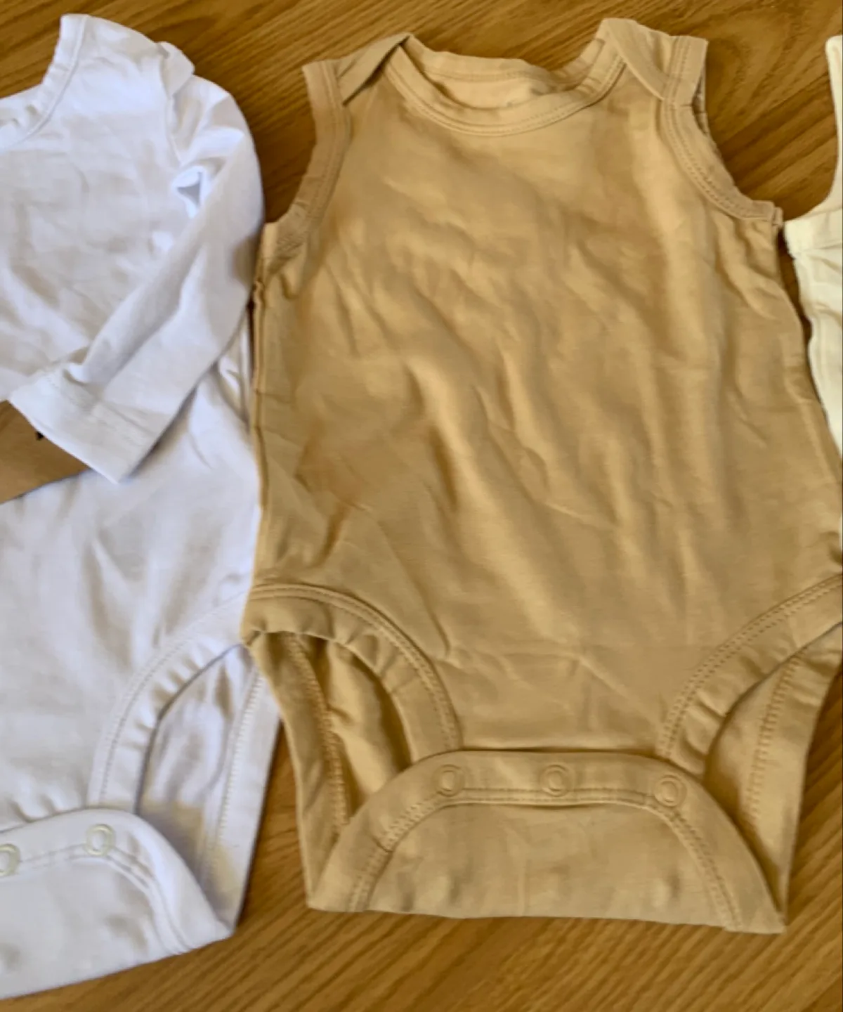 Three Baby Bodysuits - White, Beige, and Cream - 9 Months image indicator(4)