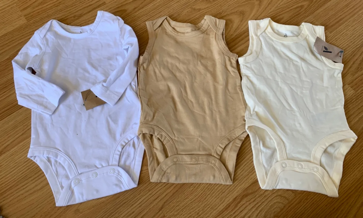 Three Baby Bodysuits - White, Beige, and Cream - 9 Months image indicator(3)