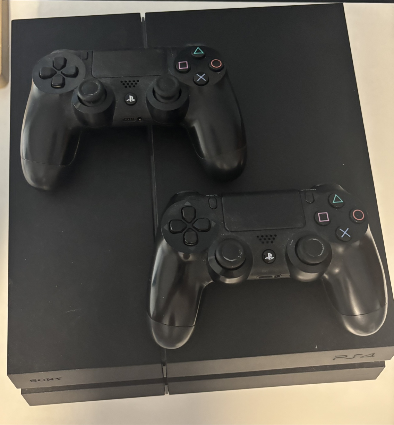 PS4 Console with Two Controllers