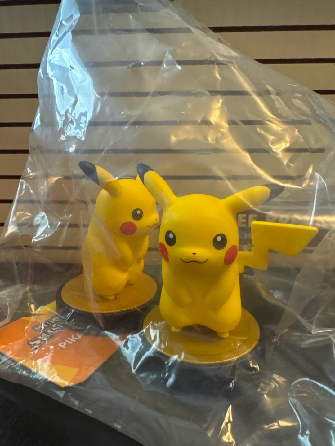 Two Super Smash Bros. Pikachu amiibo Figures with Display Case image indicator(3)