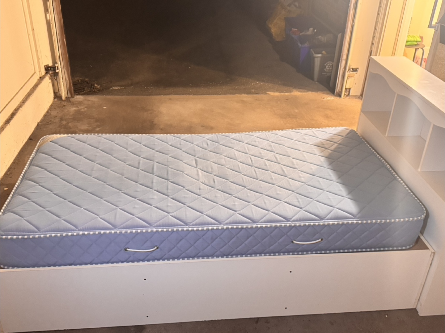 Twin-size bed frame with headboard and drawers
