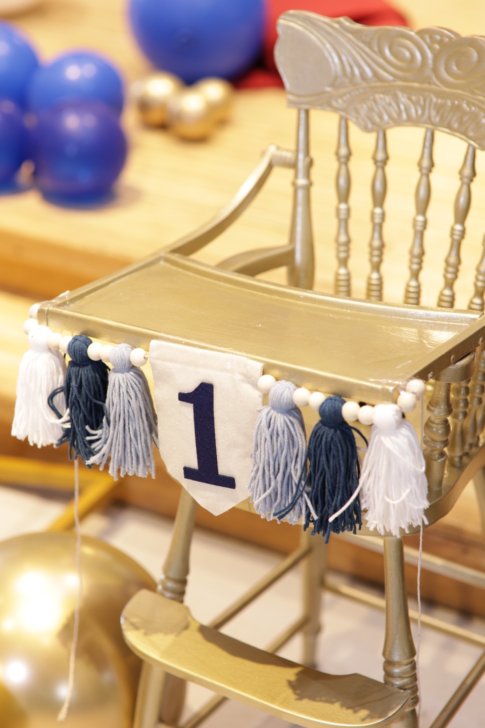 Gold Highchair with First Birthday Banner
