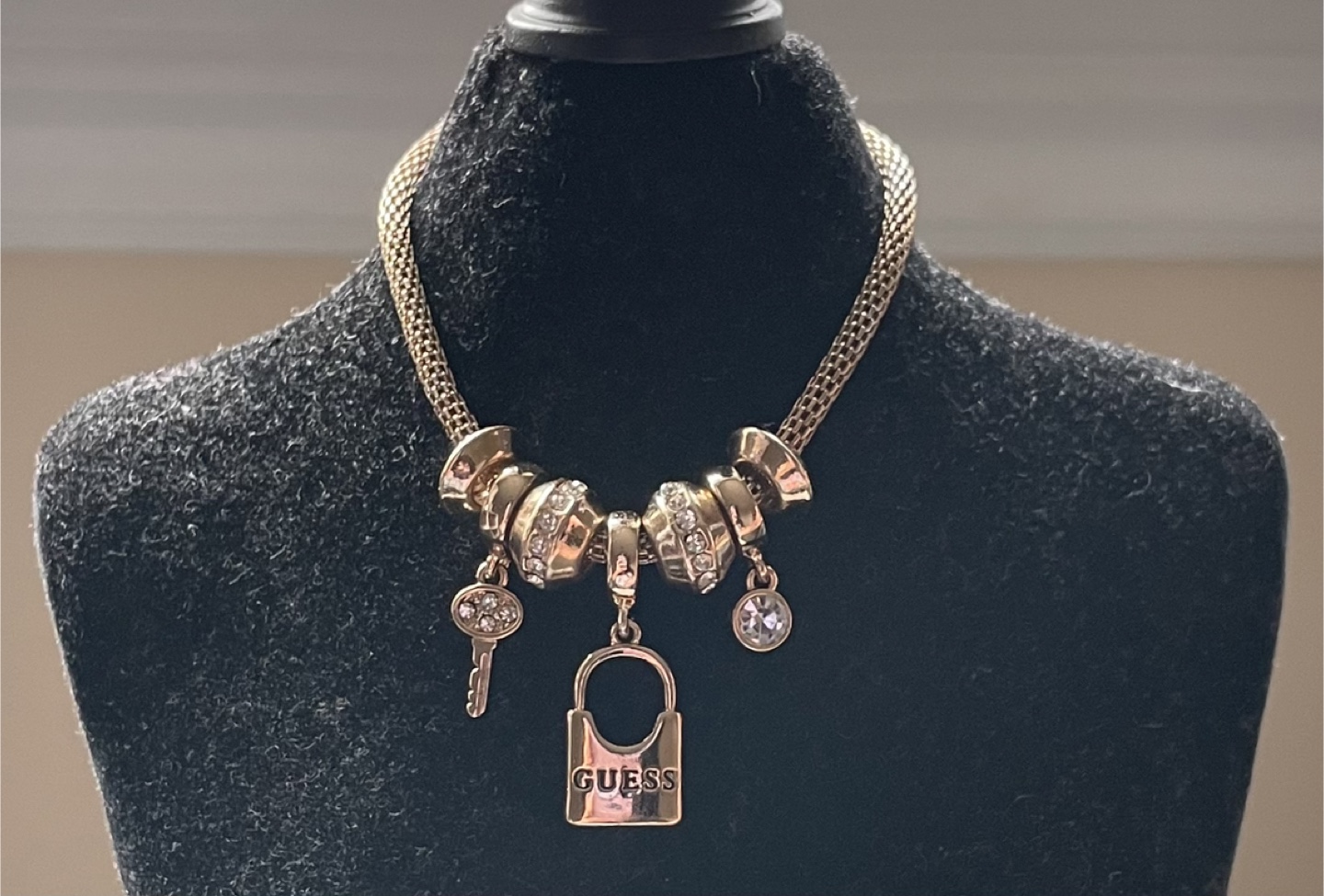 Guess’ Gold-Toned Charm Bracelet
