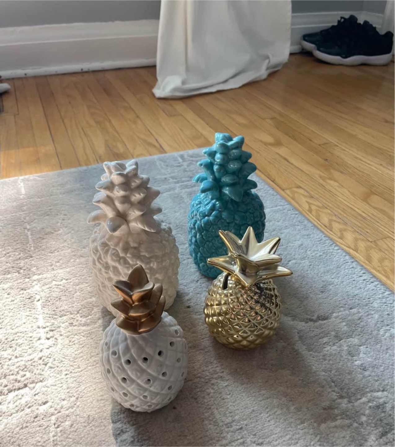 Set of four pineapple figurines