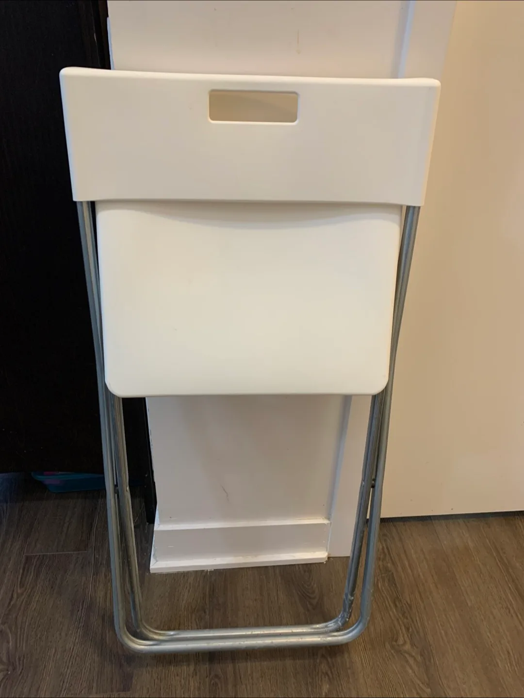 Set of four white folding chairs thumbnail