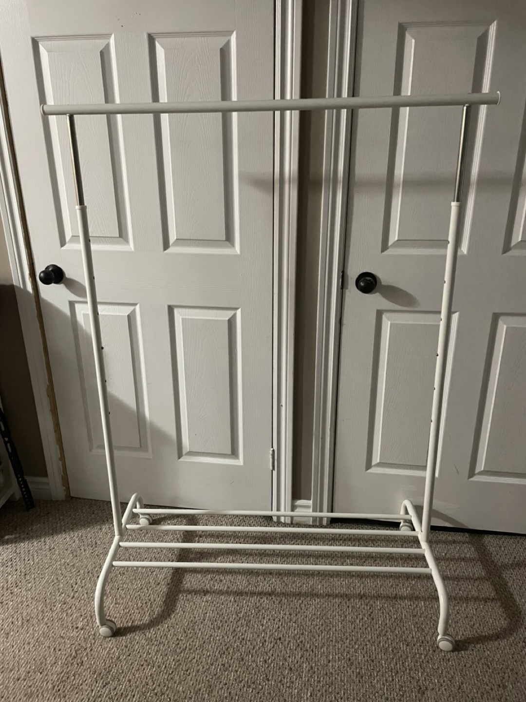 Adjustable White Clothing Rack with Wheels