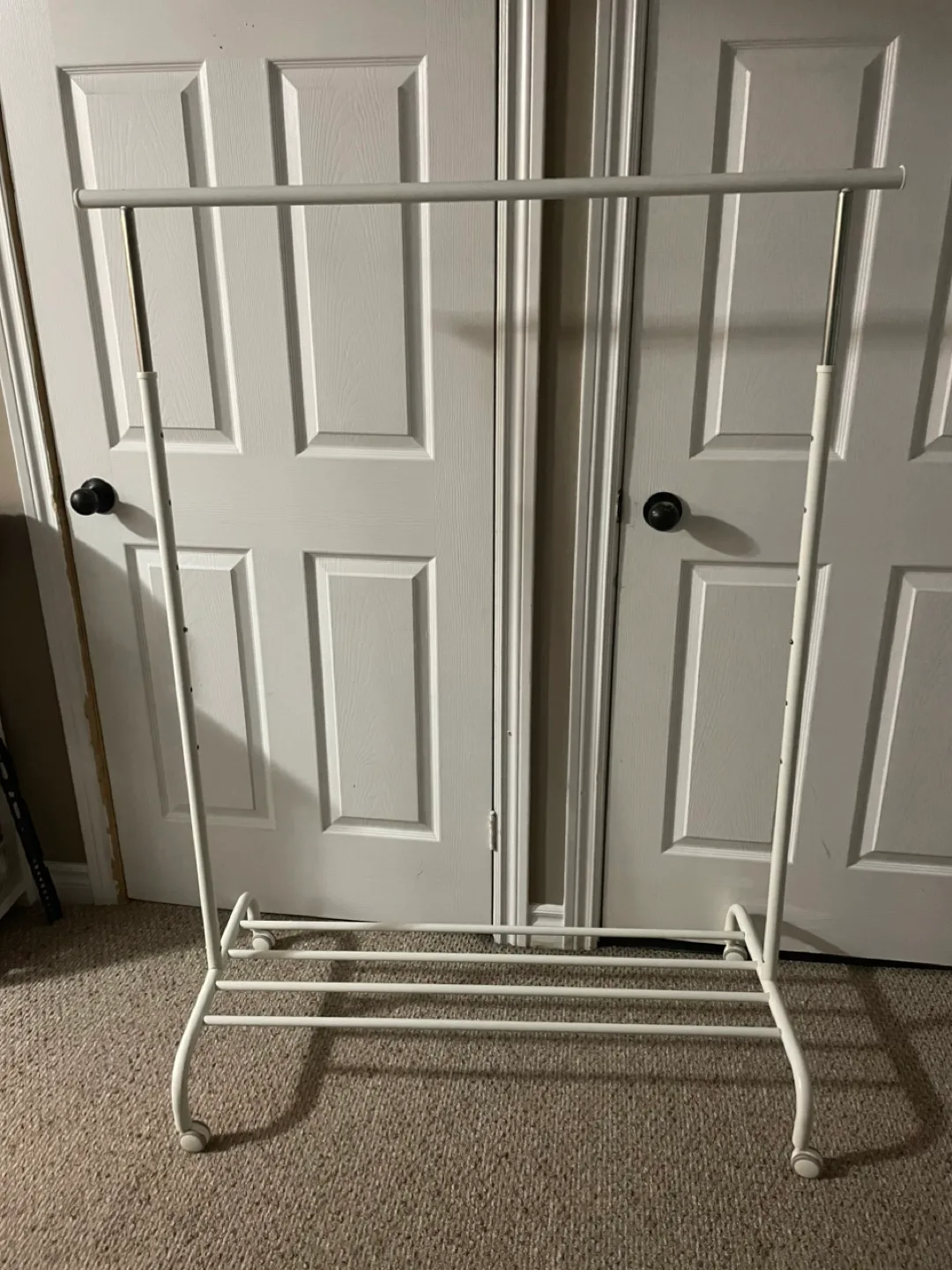 Adjustable White Clothing Rack with Wheels thumbnail