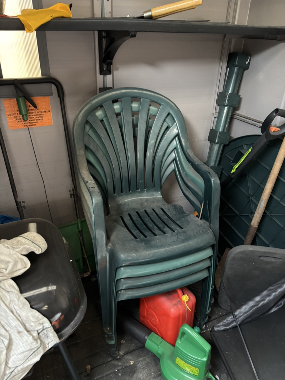 Stack of 4 Green Plastic Outdoor Chairs