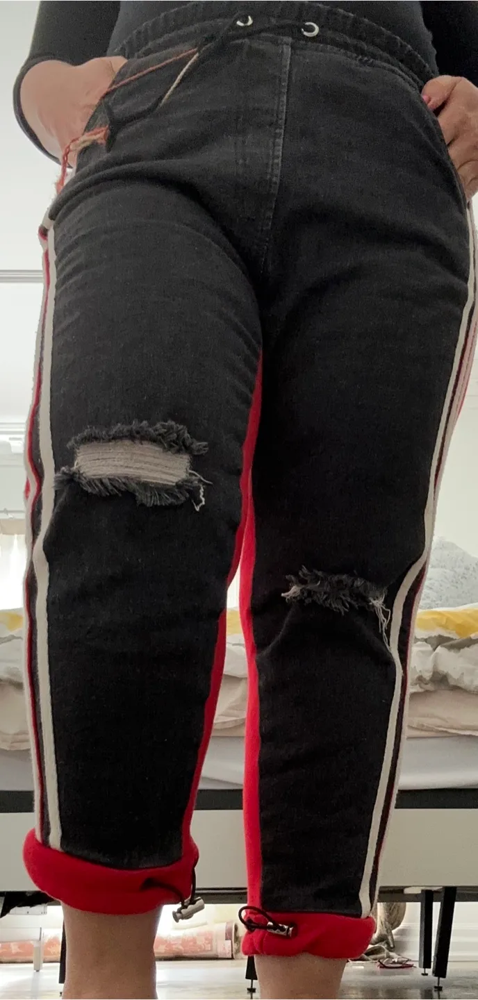 Distressed Black and Red Jeans with Side Stripes image indicator(3)