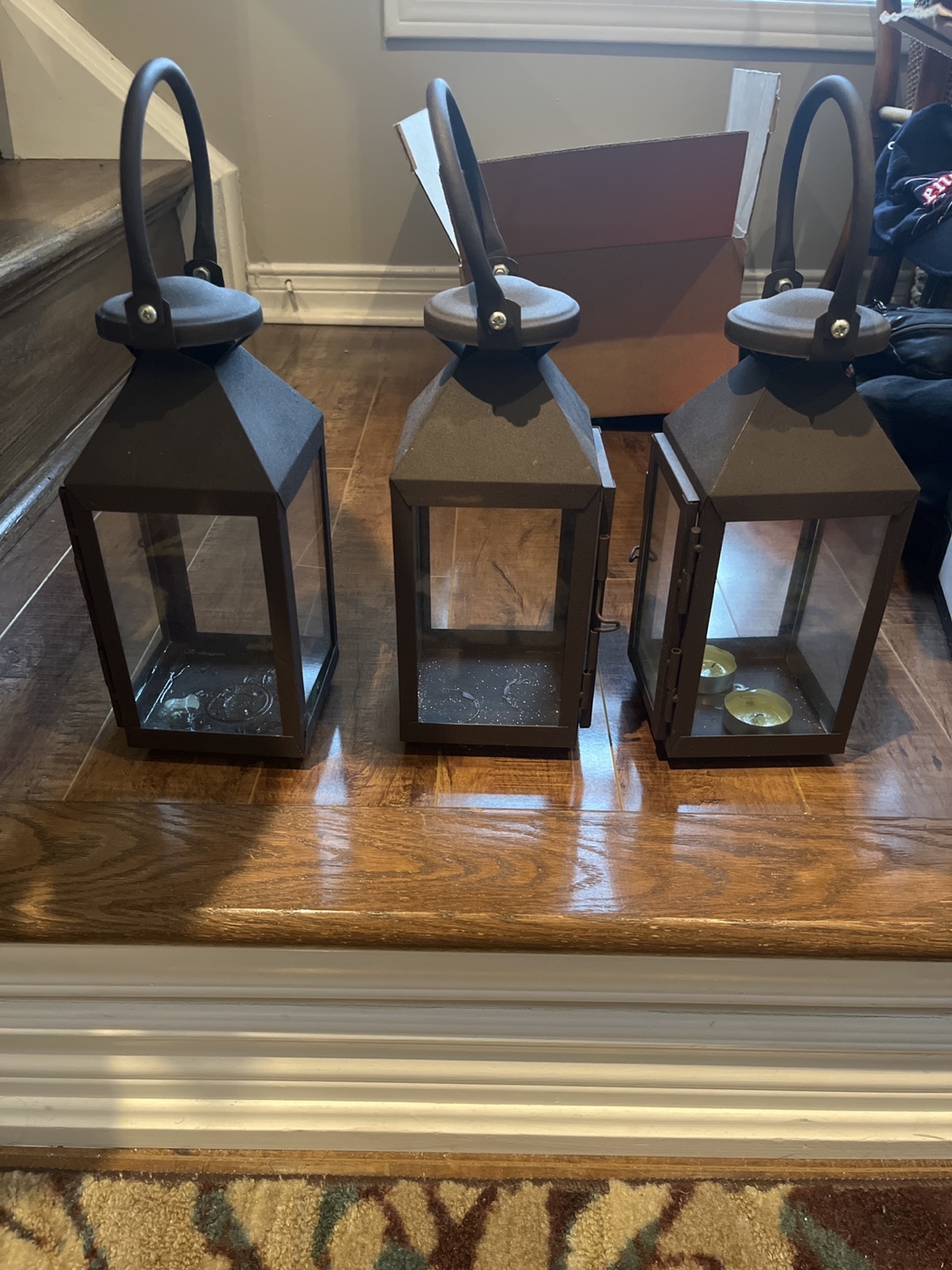 Set of three dark brown metal lanterns