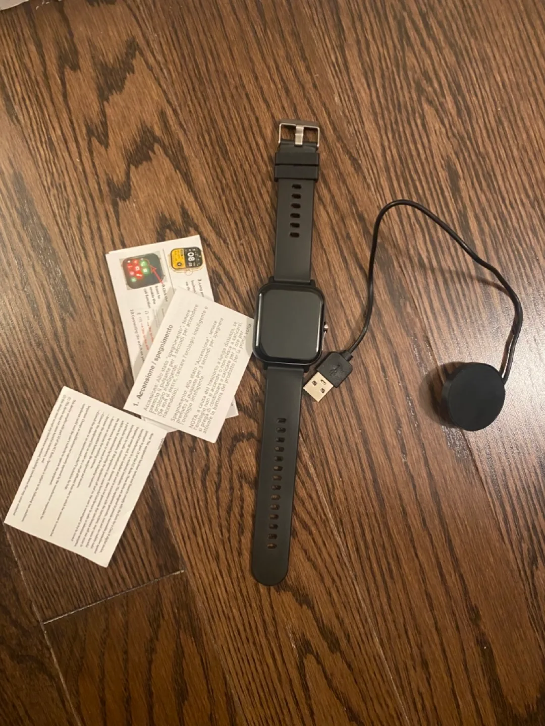 Smartwatch with USB charging cable and user manual image indicator(3)