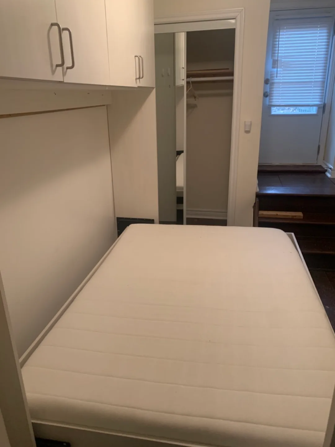 Wall-mounted Murphy bed with storage cabinets thumbnail