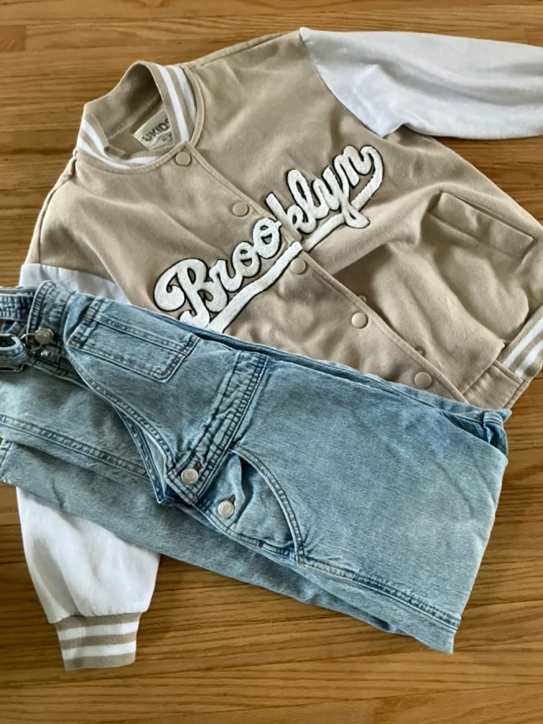 Kids Outfit: Tan Varsity Jacket and Light Wash Denim Overalls image indicator(10)