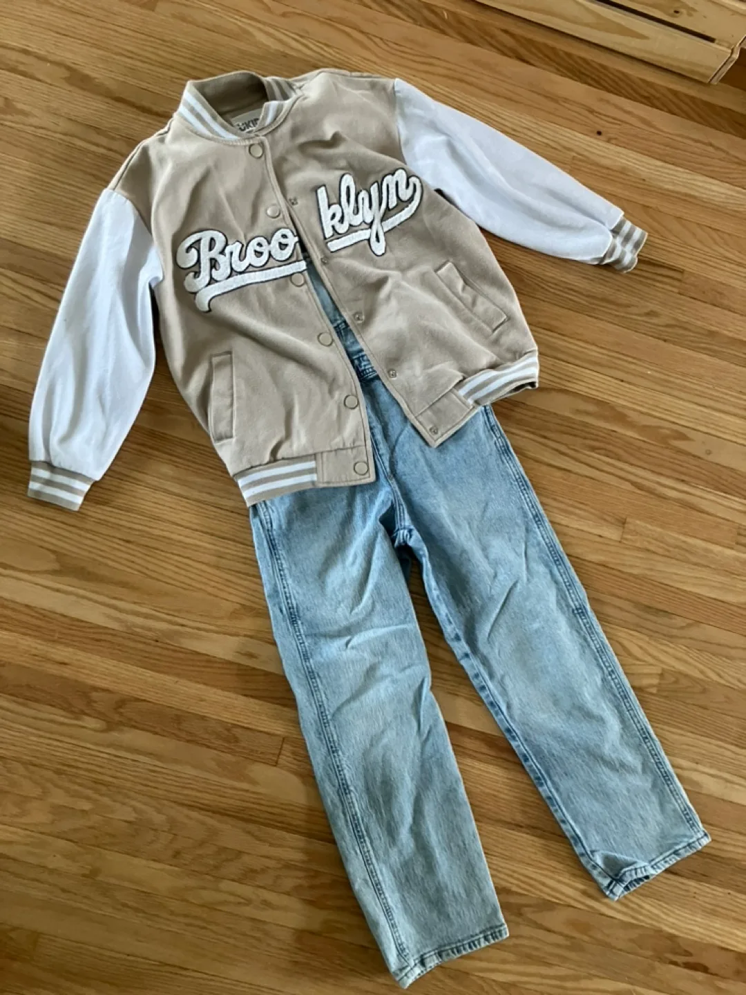 Kids Outfit: Tan Varsity Jacket and Light Wash Denim Overalls image indicator(3)