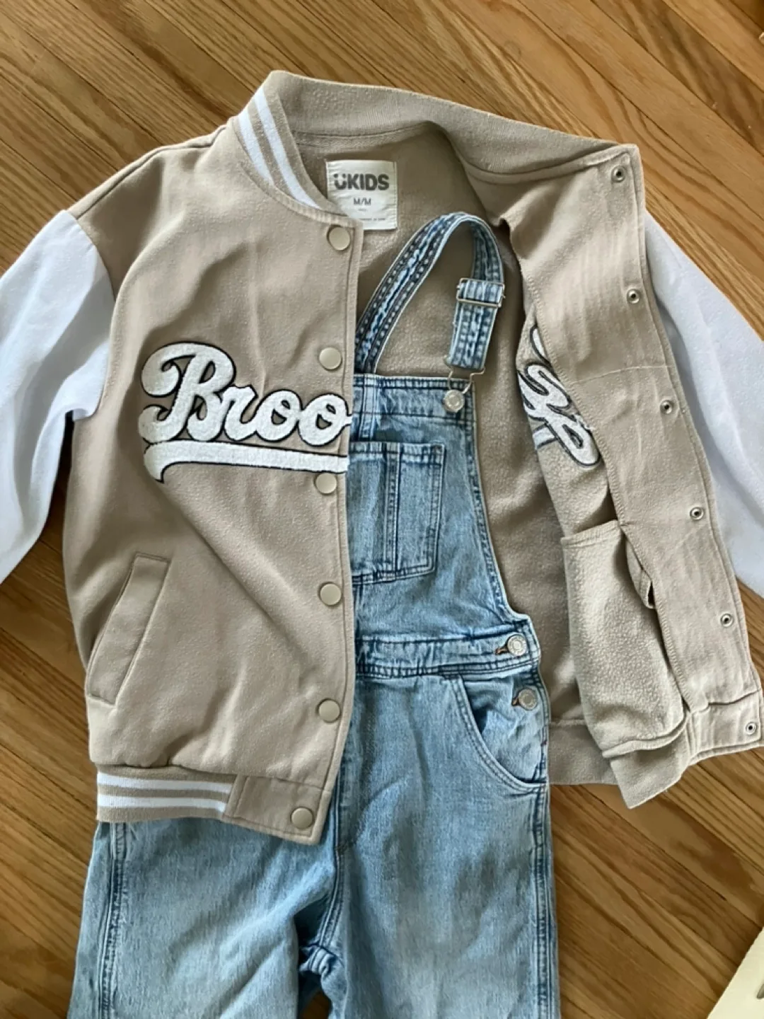 Kids Outfit: Tan Varsity Jacket and Light Wash Denim Overalls image indicator(4)