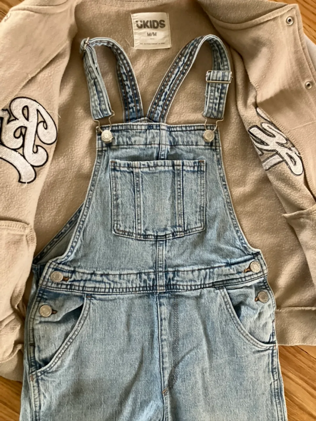 Kids Outfit: Tan Varsity Jacket and Light Wash Denim Overalls image indicator(7)