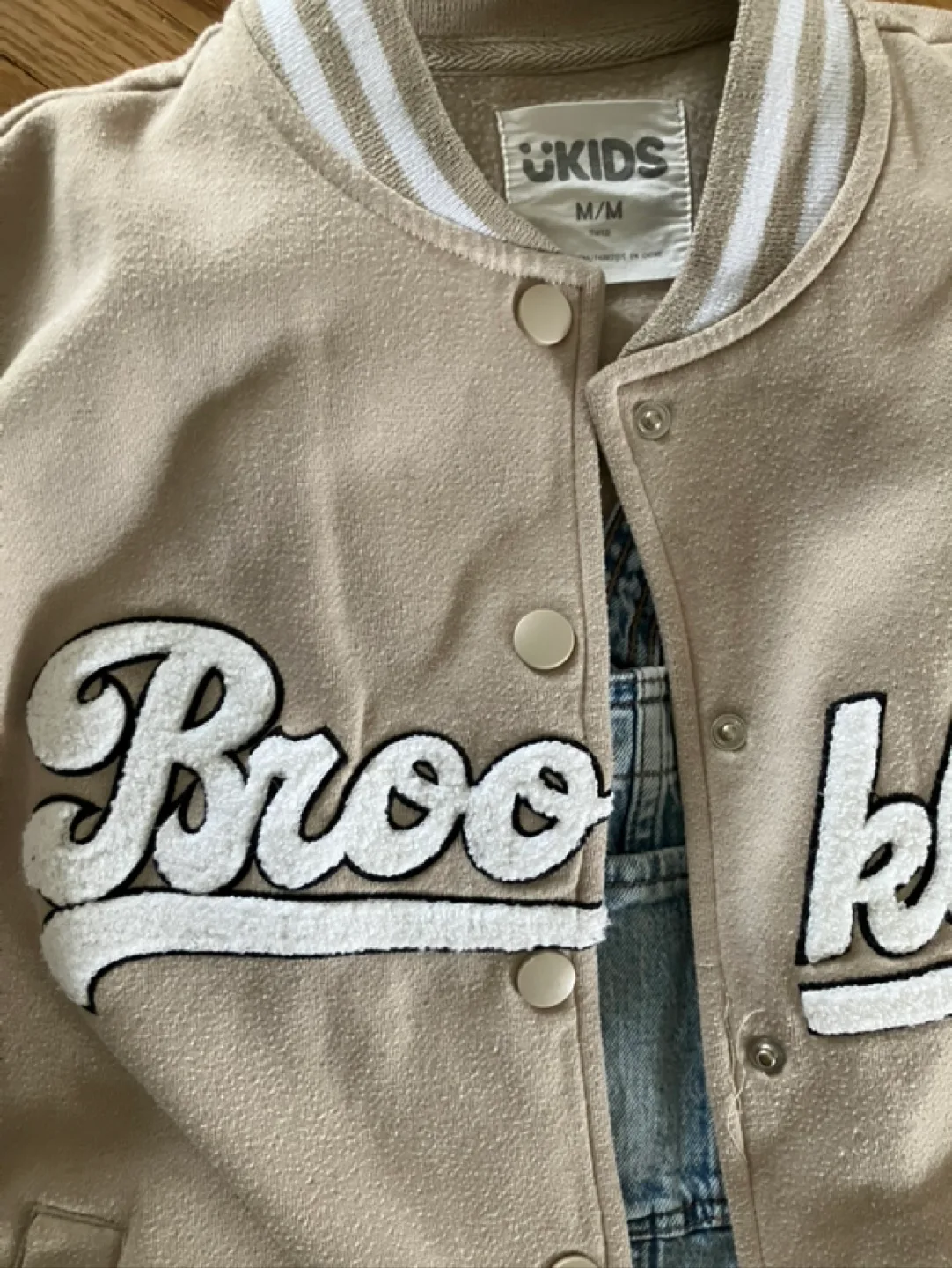 Kids Outfit: Tan Varsity Jacket and Light Wash Denim Overalls image indicator(9)