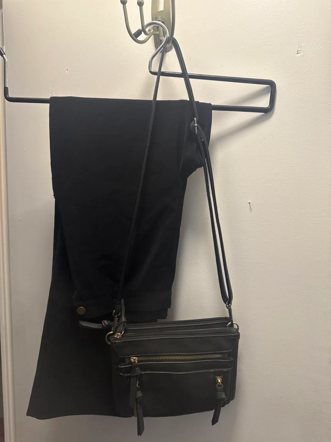Black pants and crossbody bag thumbnail