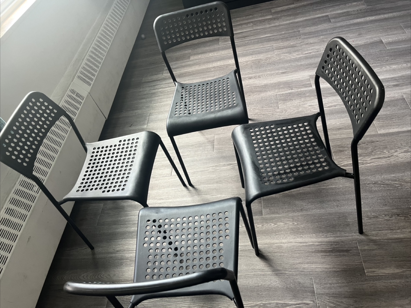 Four Black Plastic Chairs