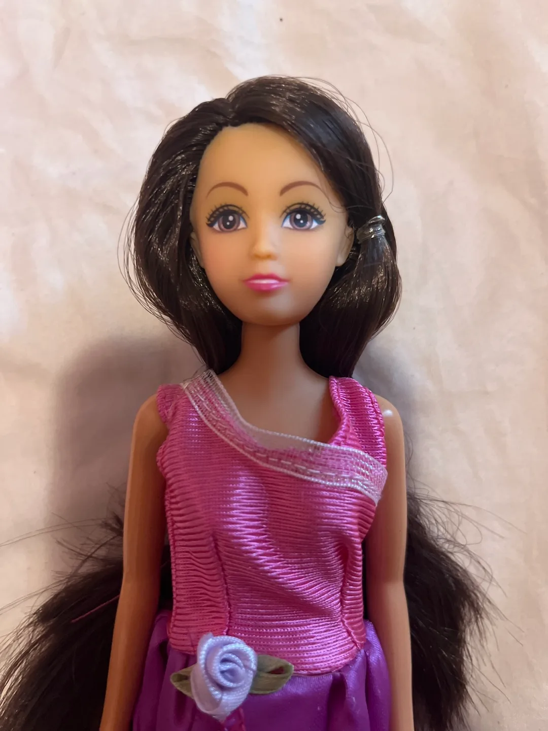 Beautiful brunette doll in purple dress thumbnail