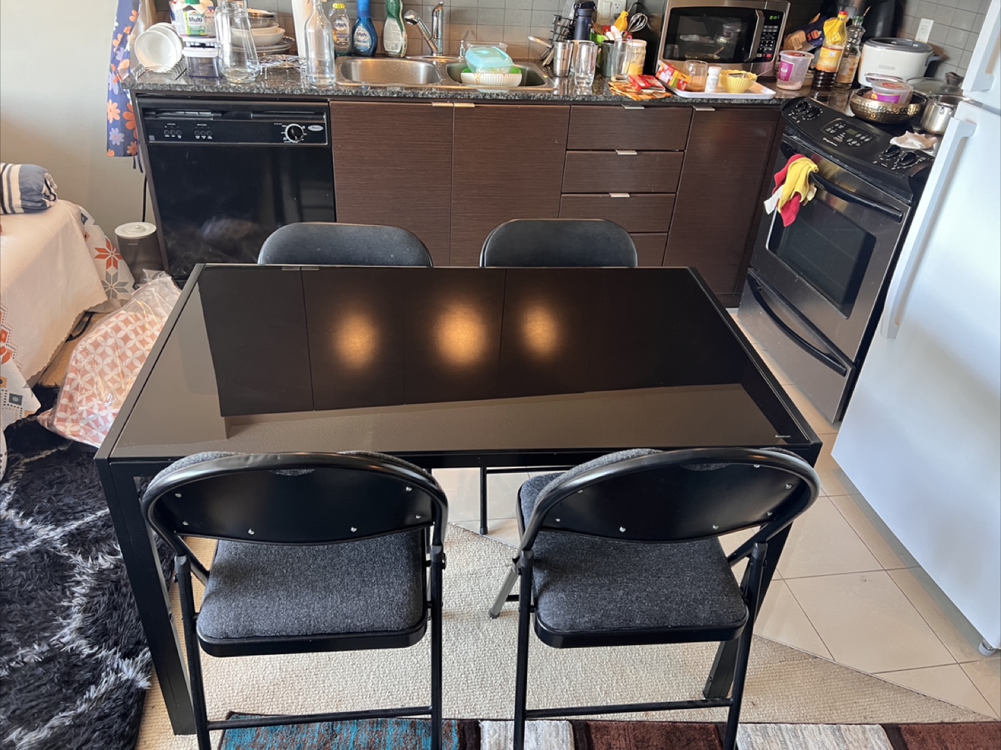 Black Glass Dining Table with Four Folding Chairs - photo 3