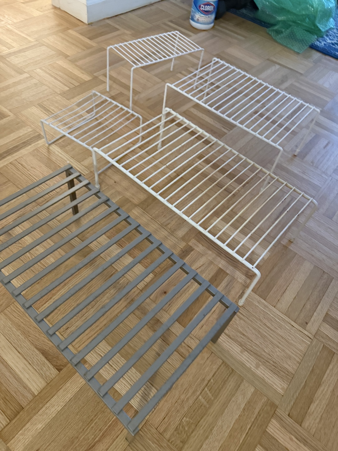 Set of 3 White Wire Shelf Risers + 1 Gray Metal Rack