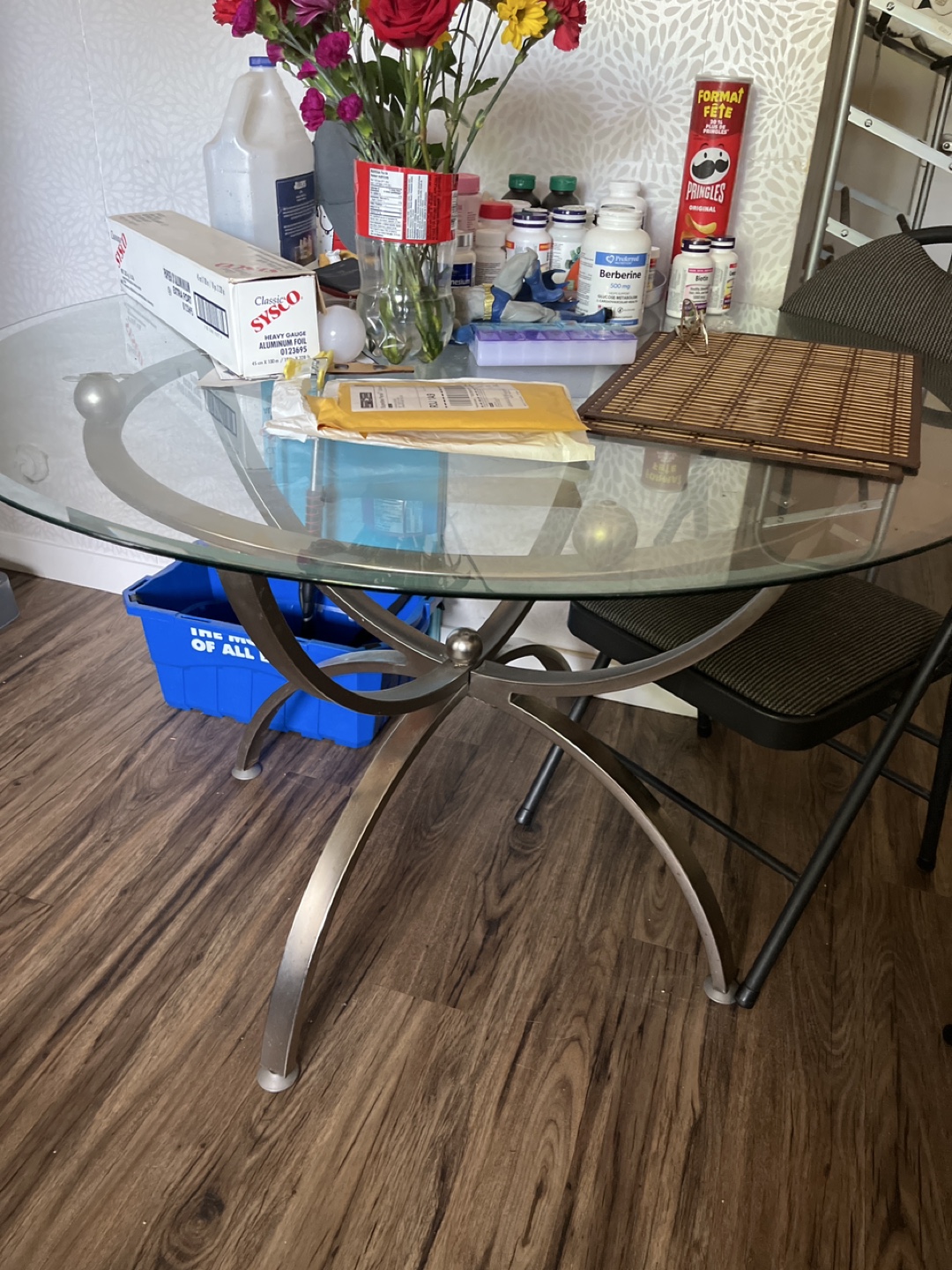 Glass top dining table with metal base