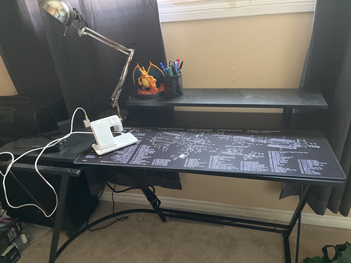 Black computer desk with AR-15 diagram mousepad