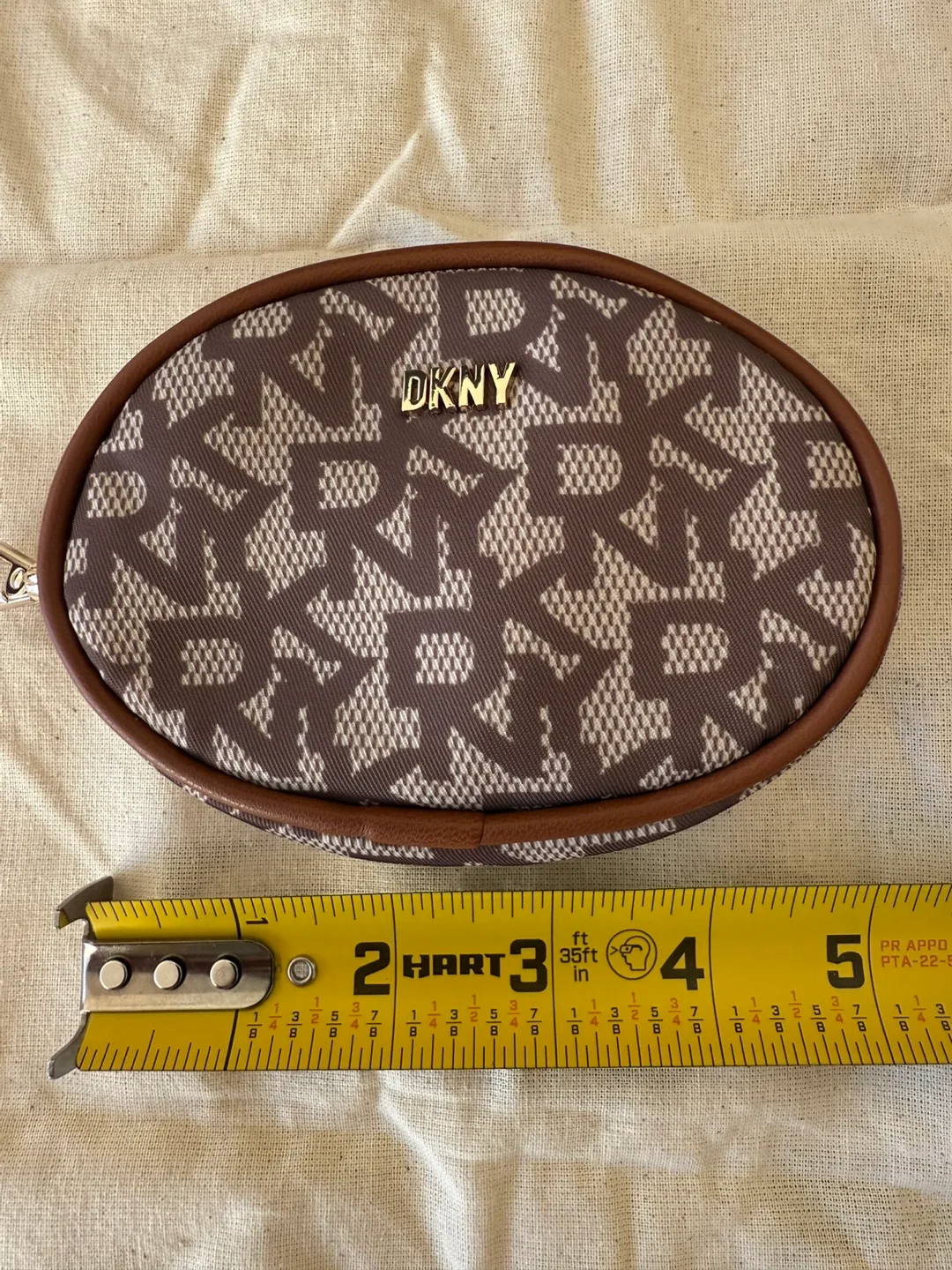 DKNY Oval-Shaped Zip Pouch with Carabiner (New) image indicator(9)
