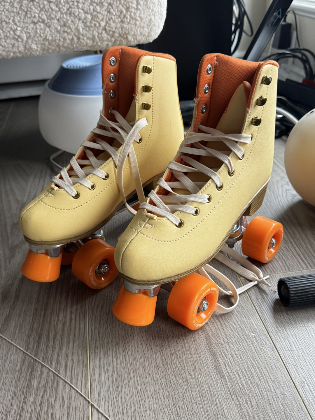 Vintage Yellow Roller Skates with Orange Wheels