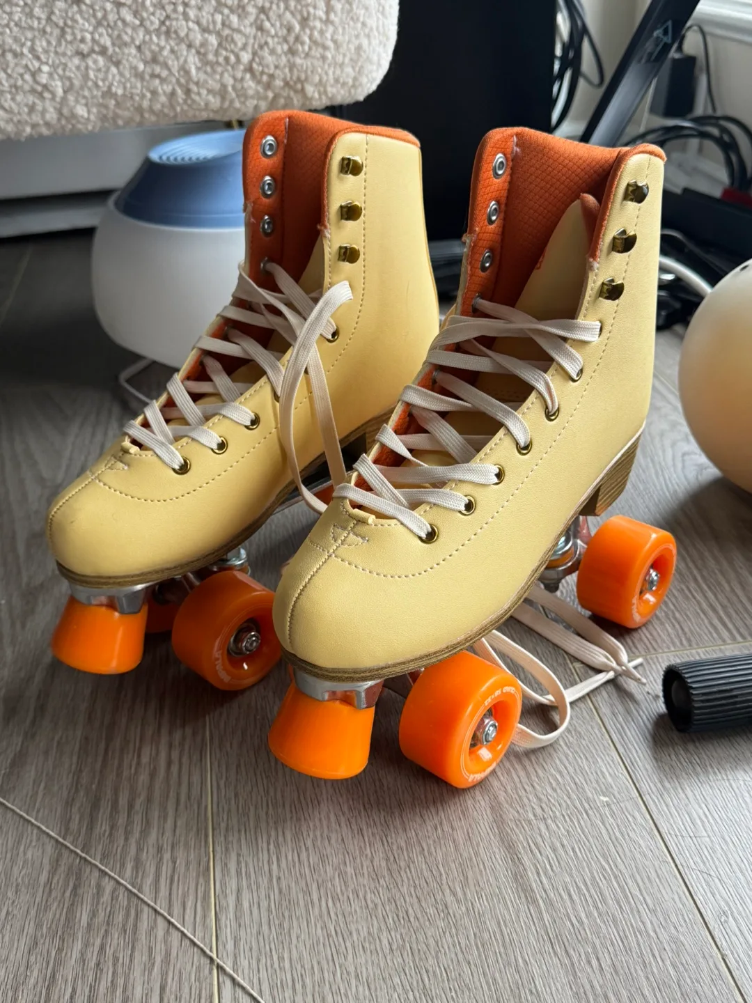 Vintage Yellow Roller Skates with Orange Wheels