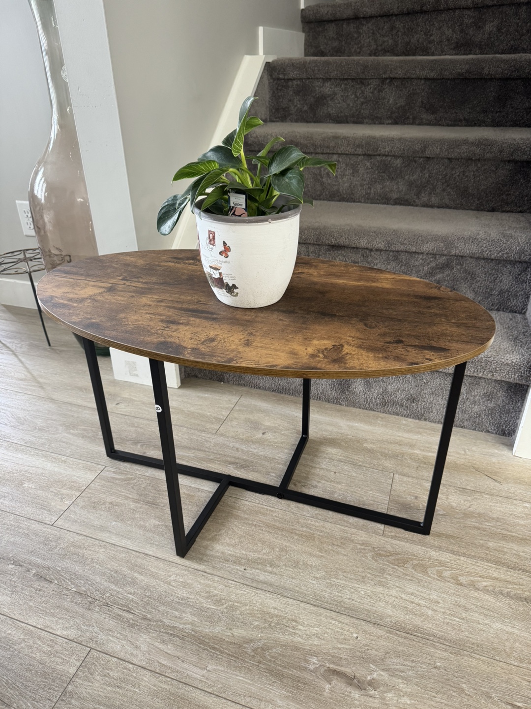 Rustic Oval Coffee Table with Black Metal Frame