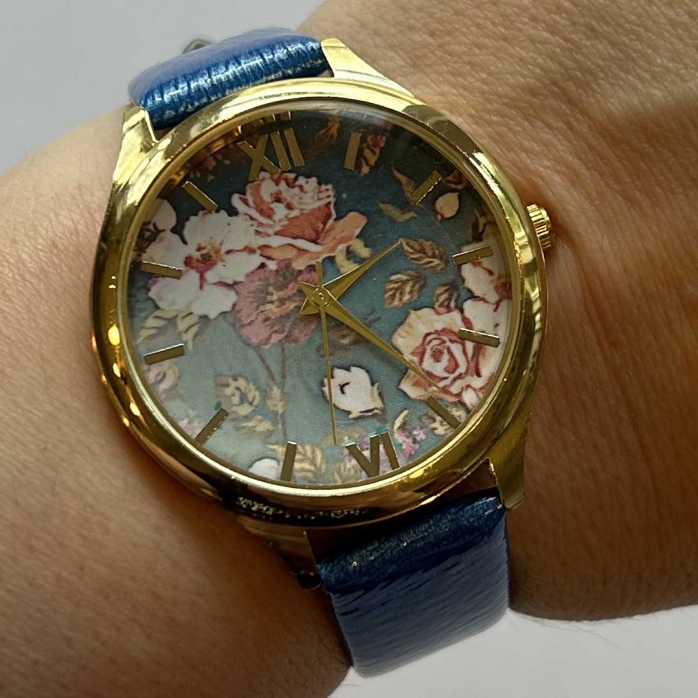 XOXO Gold Blue Analog Roman Numeral Wrist Watch with Floral Face
