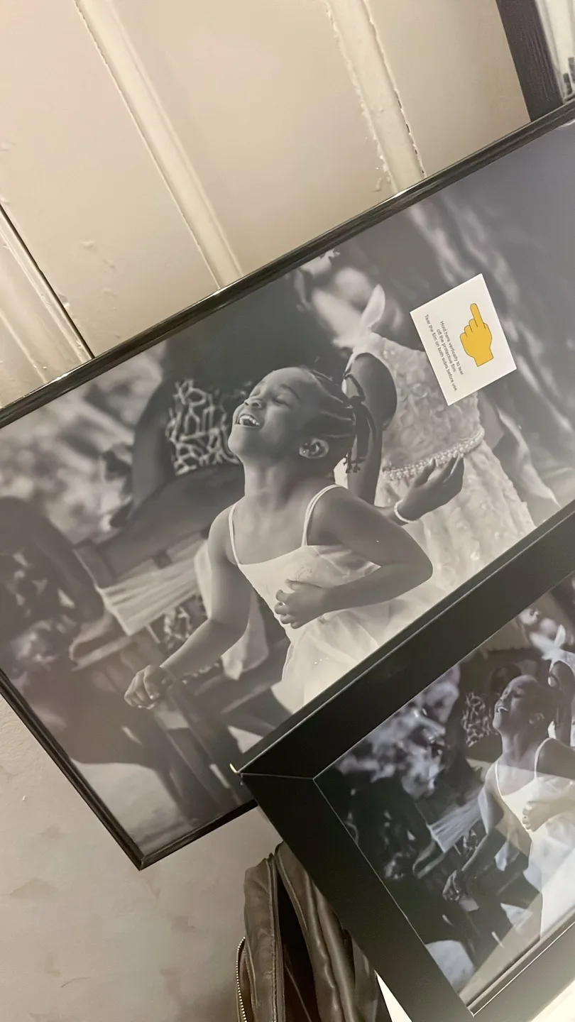 Framed Black and White Photograph of a Joyful Girl image indicator(2)