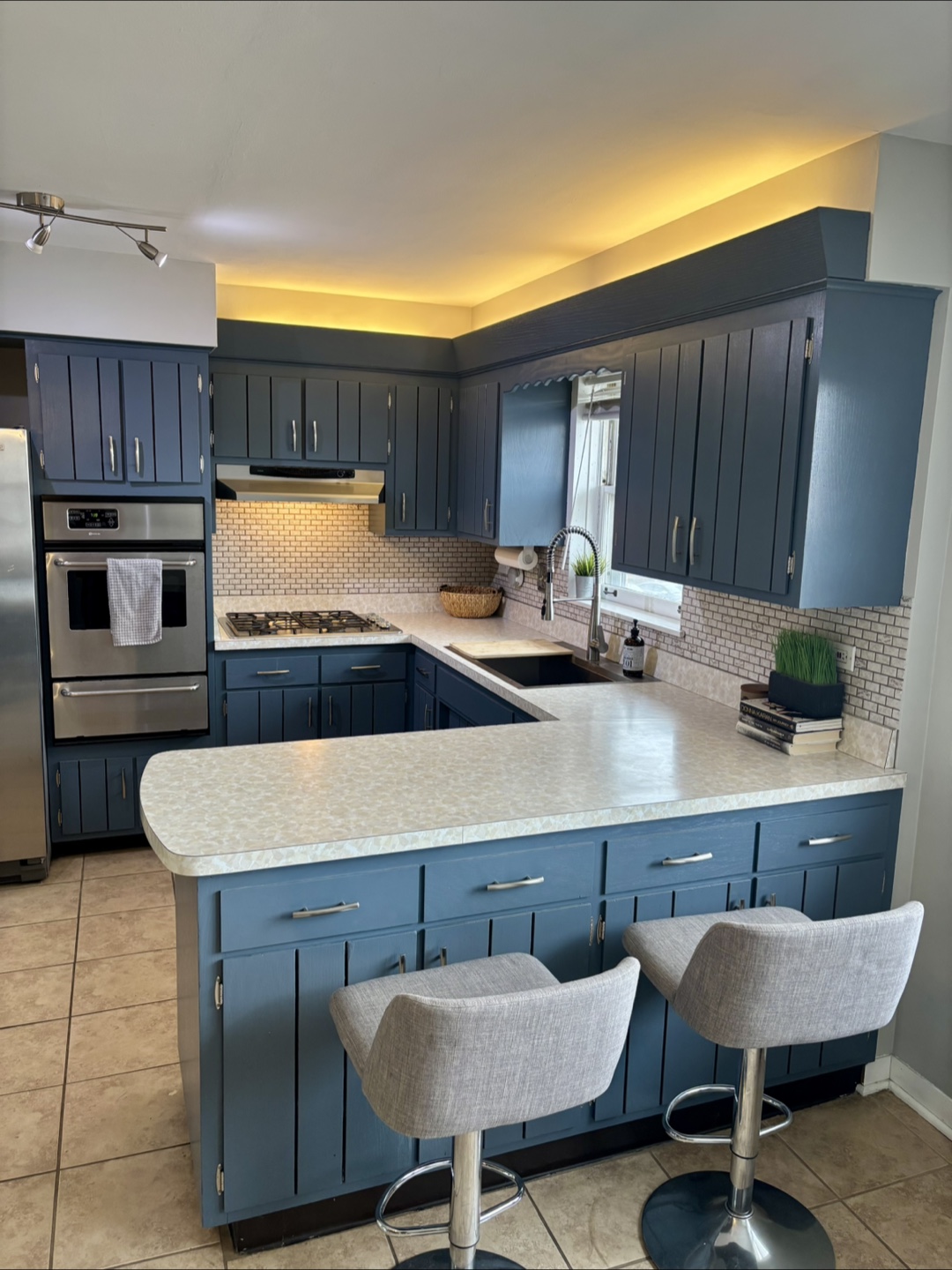 Pair of Gray Fabric Swivel Bar Stools