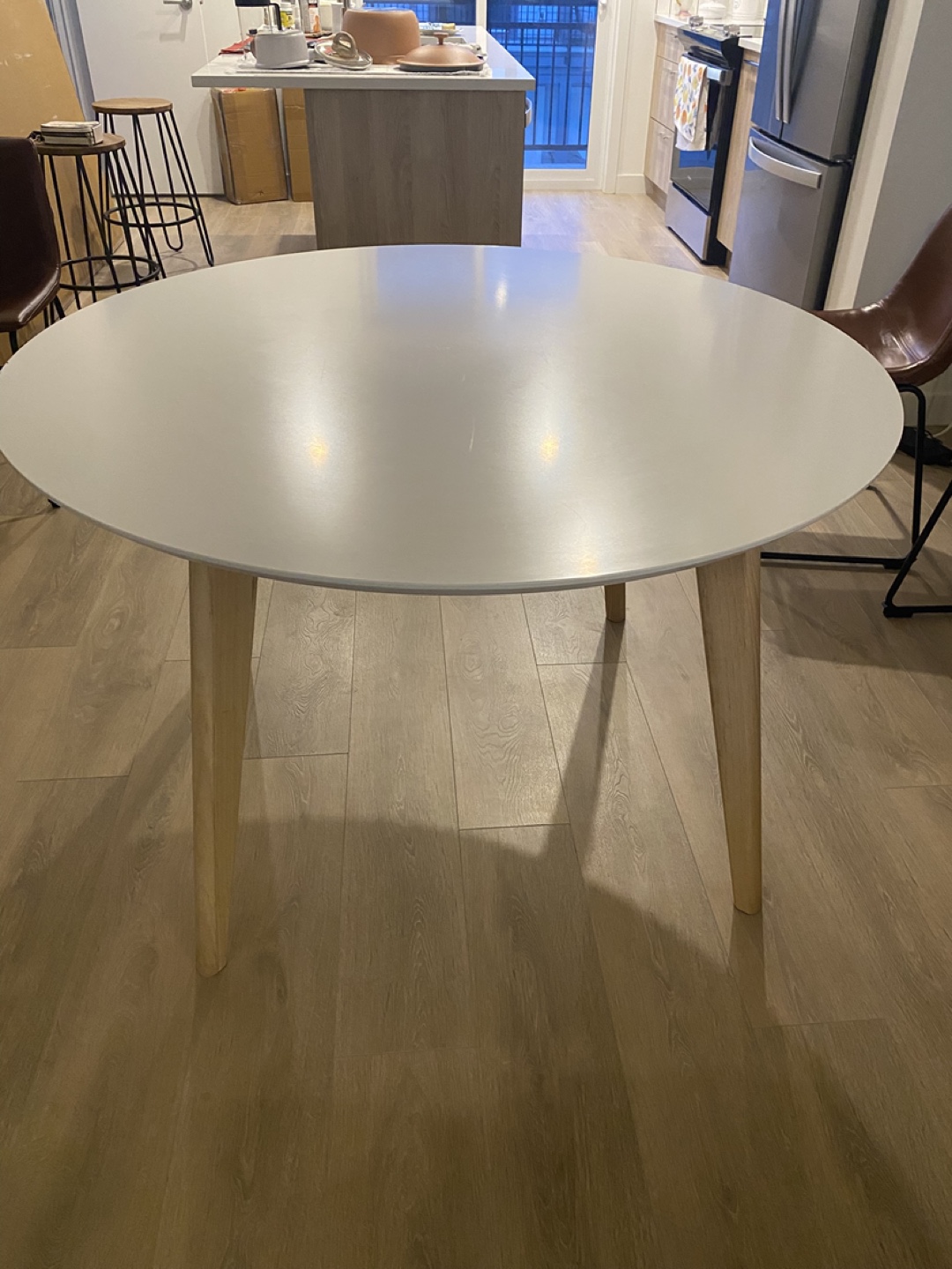 Round White Dining Table with Light Wood Legs - photo 3