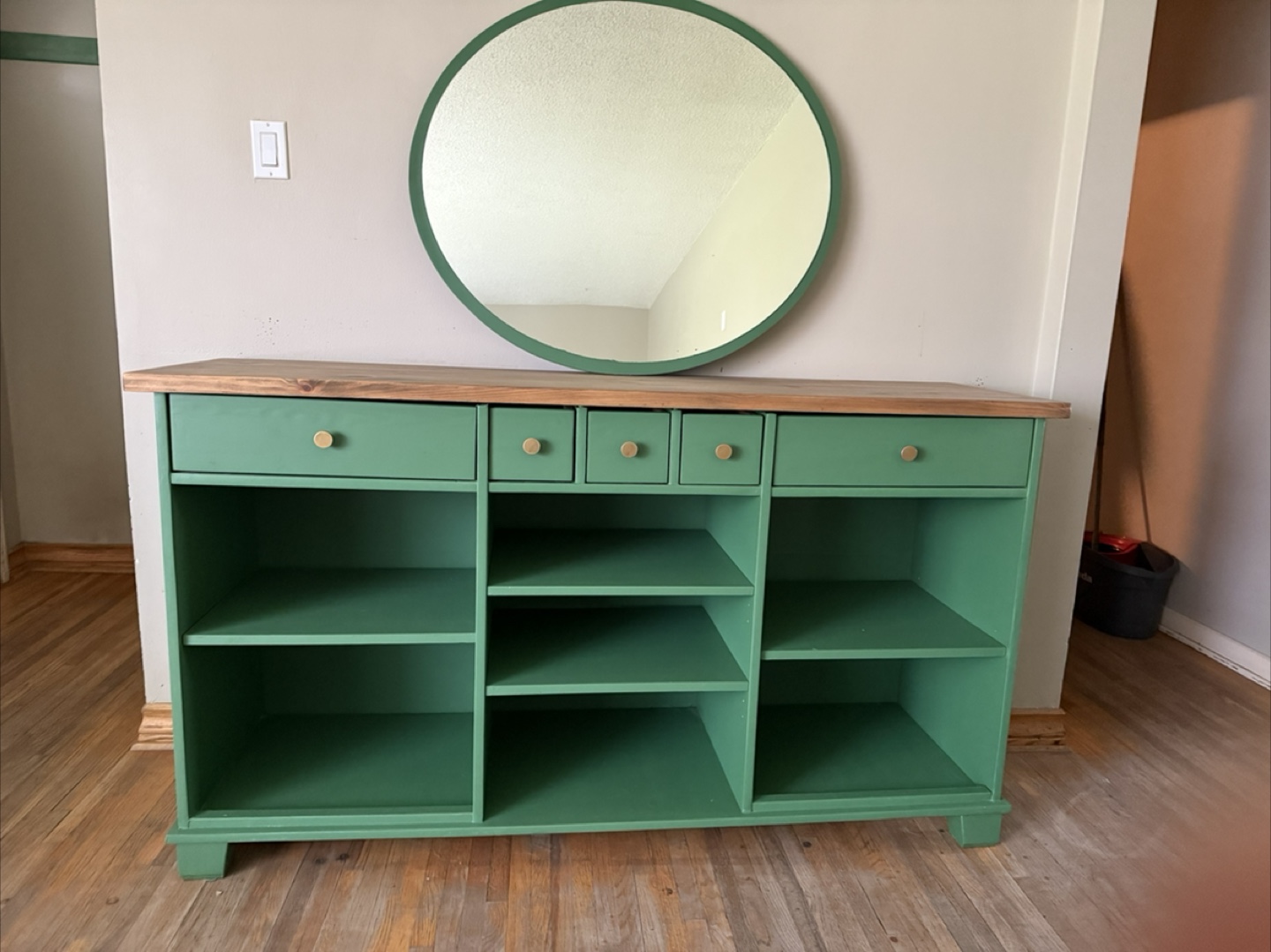 Custom-painted green console table with shelving and drawers - photo 5