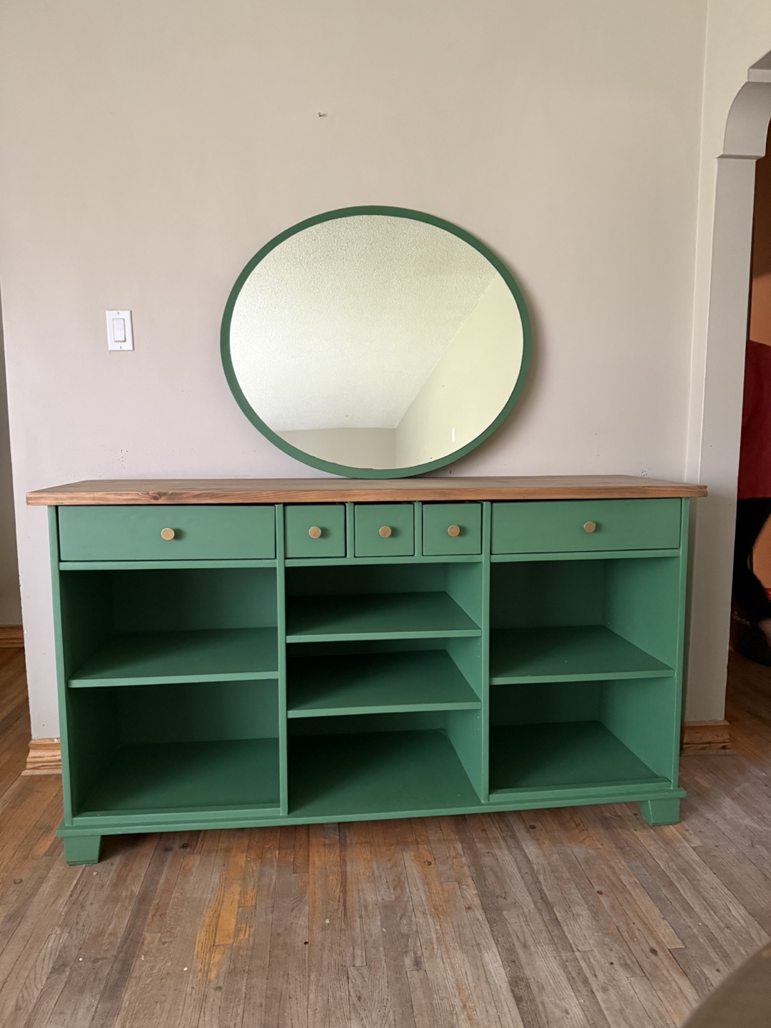 Custom-painted green console table with shelving and drawers - photo 4