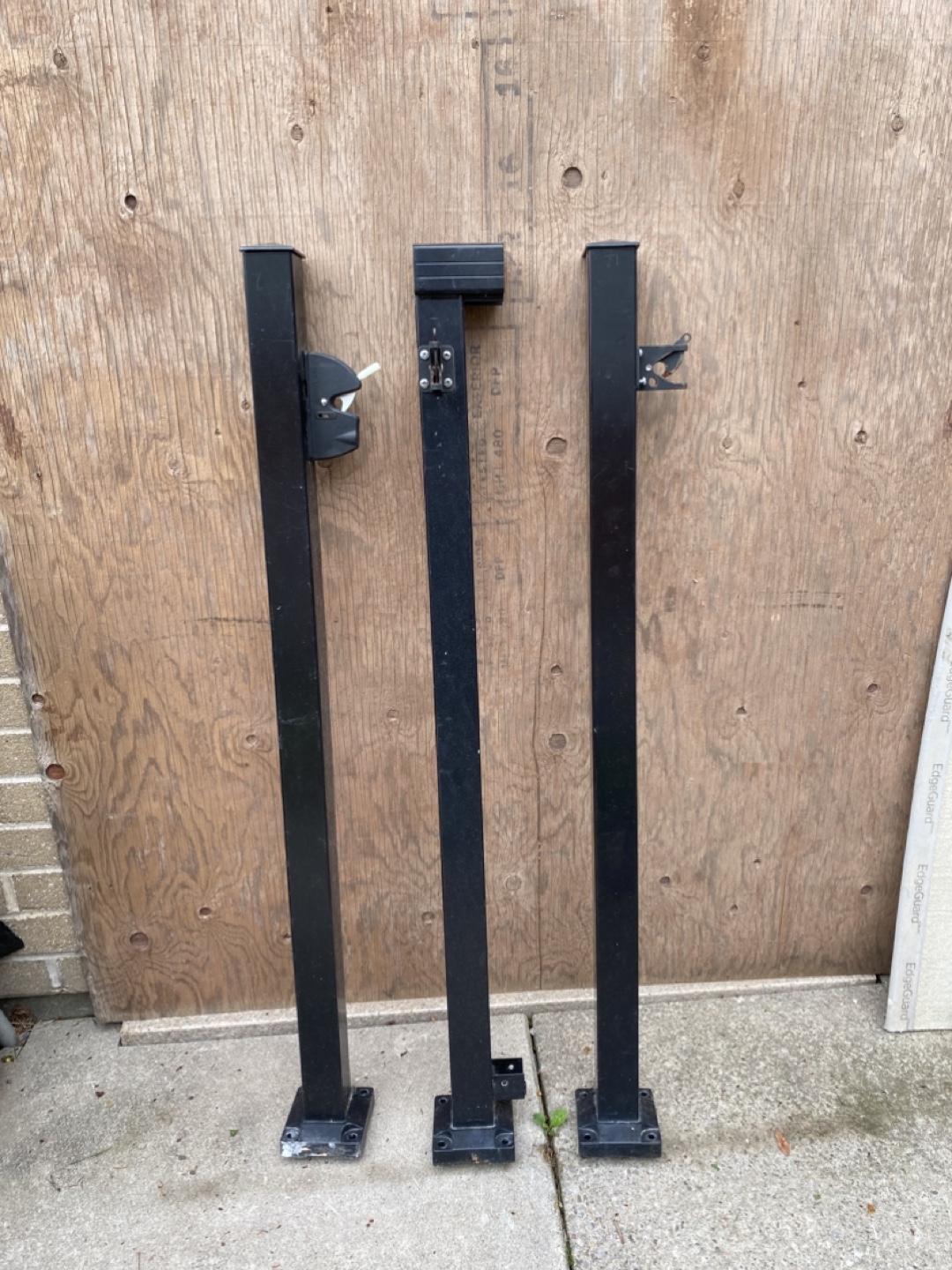 Three Black Metal Fence Posts with Hardware