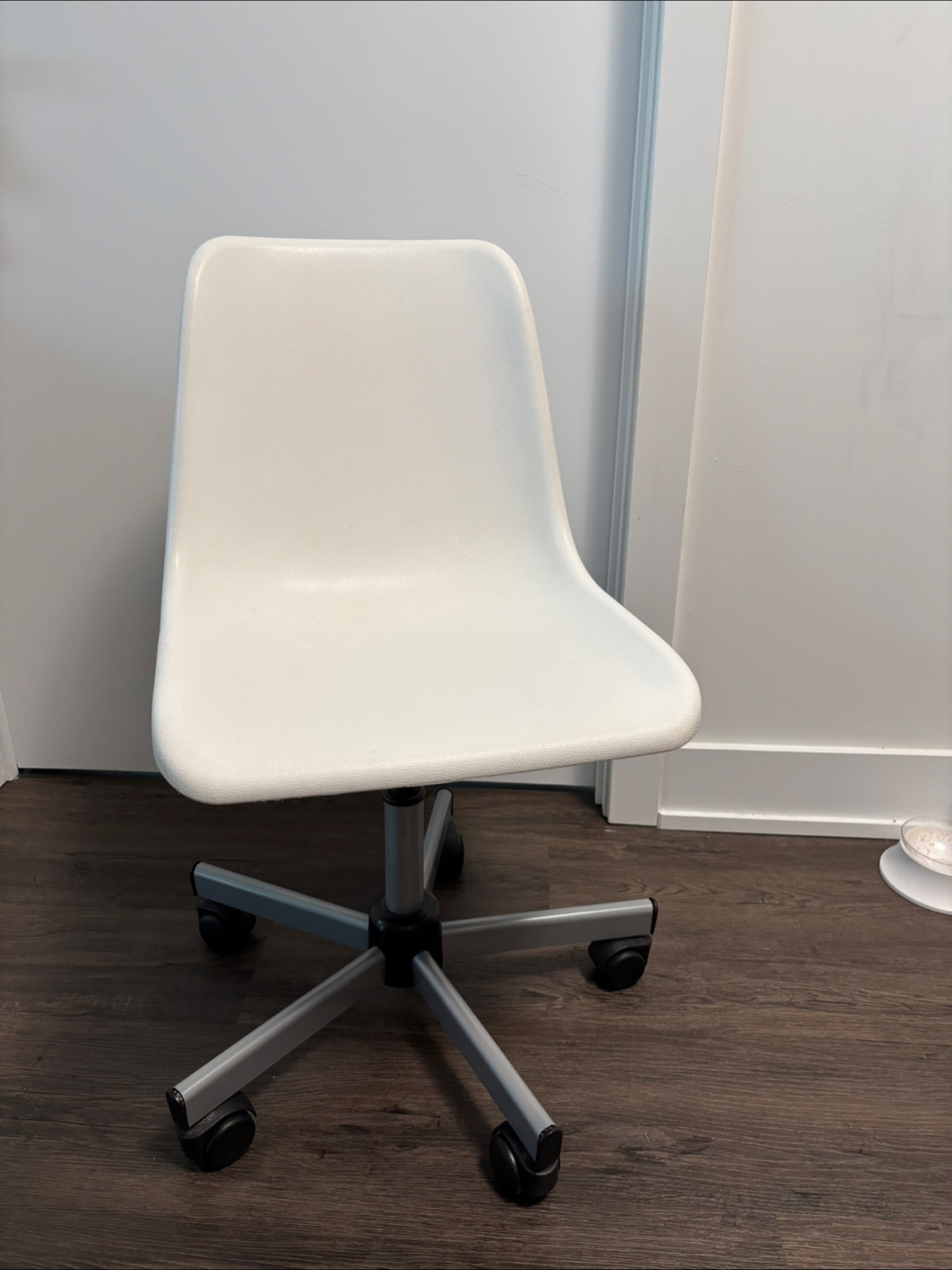 White plastic office chair with wheels