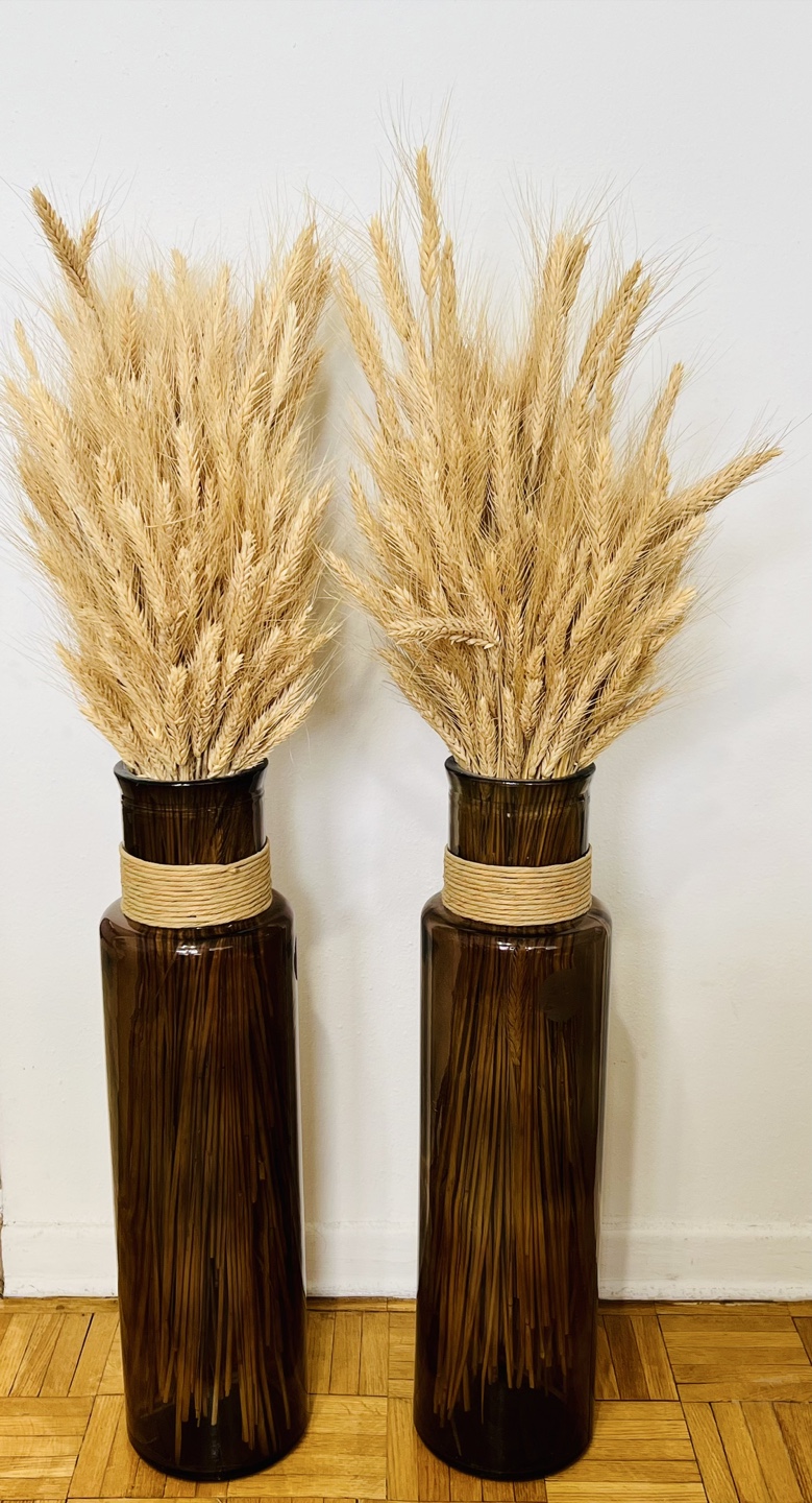 A pair of glass floor vases – available w/without dried wheat