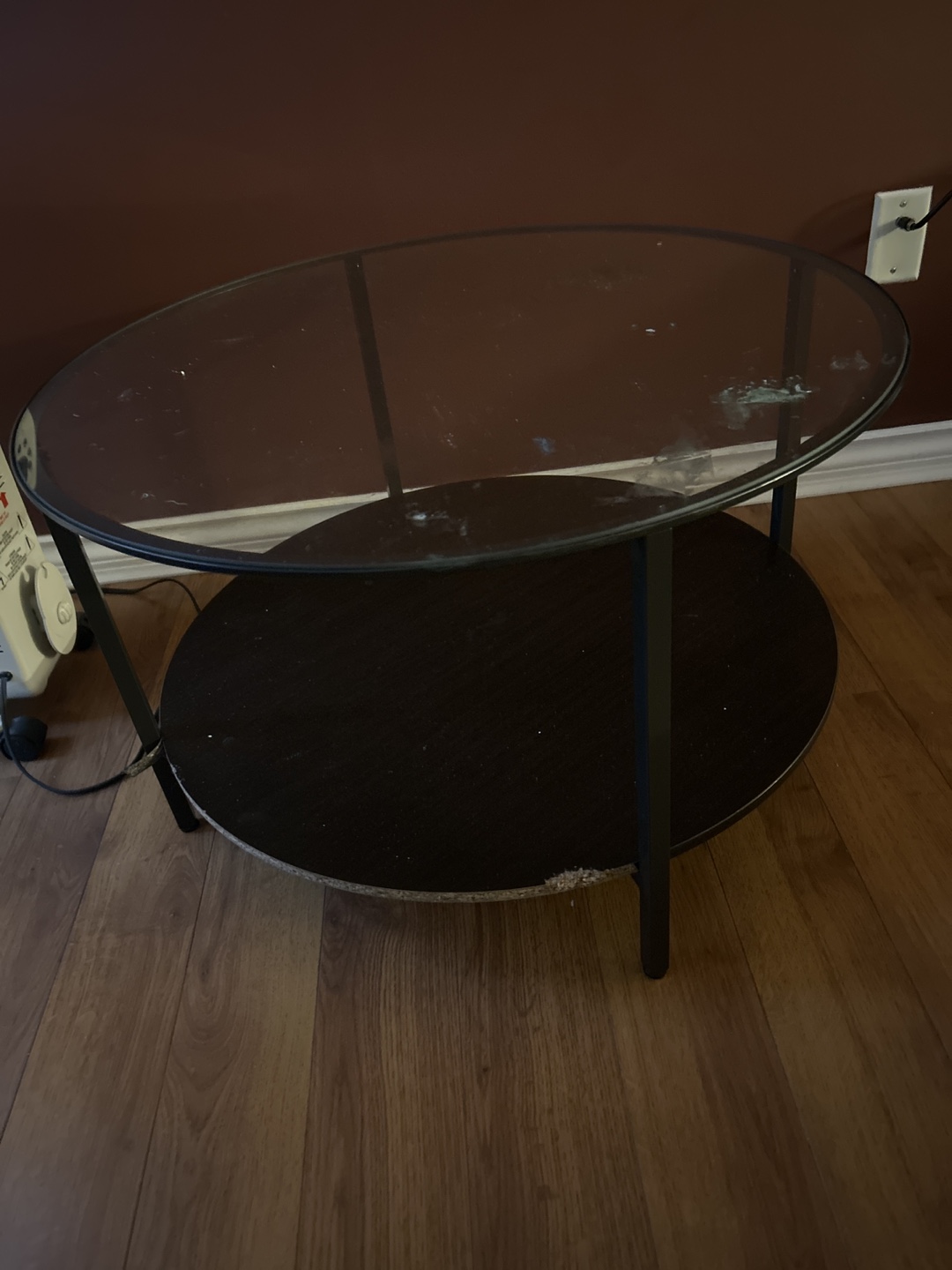 Glass-top coffee table with lower shelf