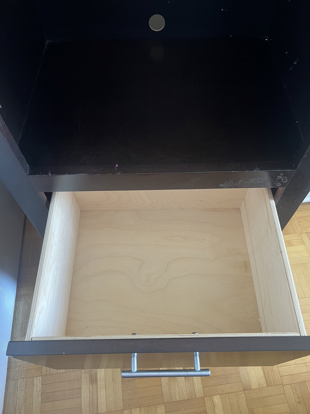 Dark brown wooden storage cabinet