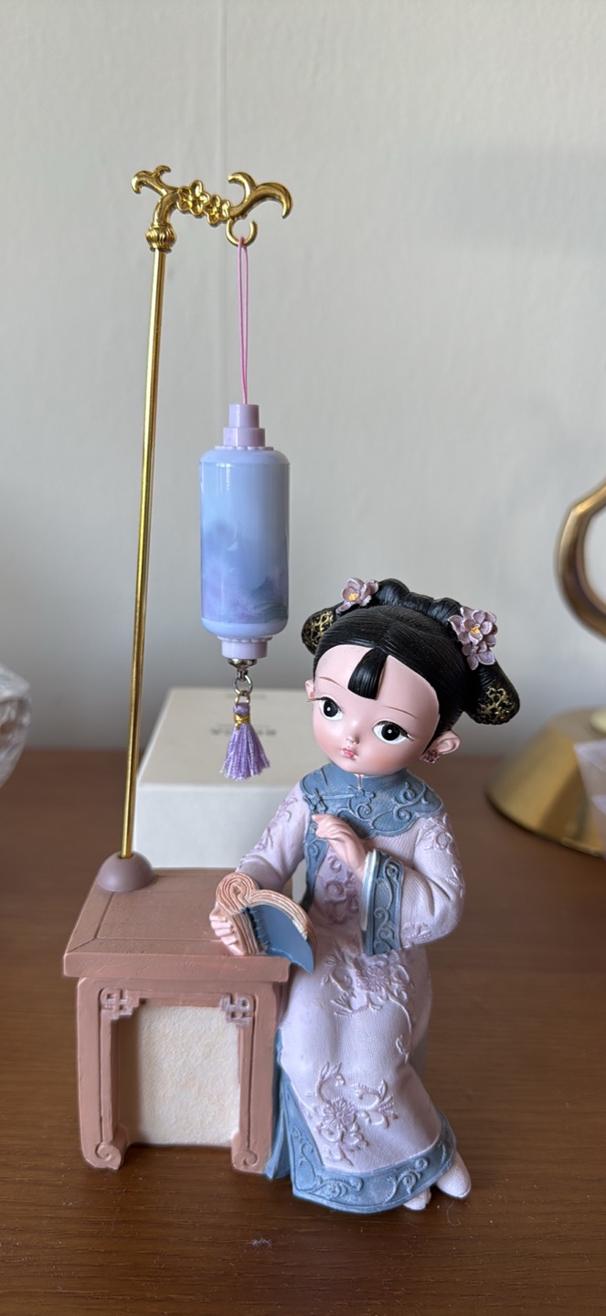 Figurine of a Girl Reading (light works) - bought in Hong Kong
