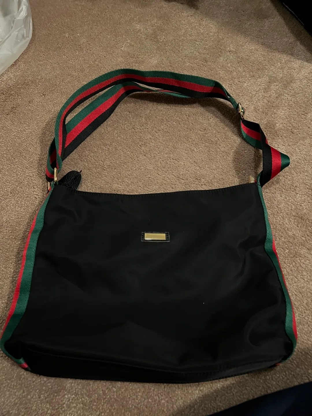 Black nylon handbag with green and red striped shoulder strap thumbnail