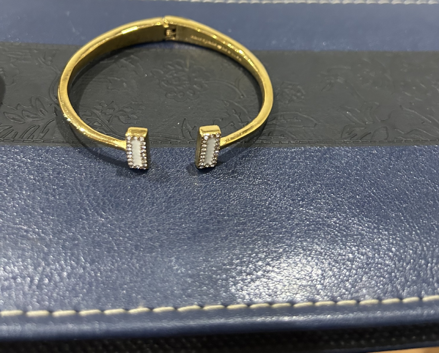 Gold-tone Hinged Bangle Bracelet with White Accents