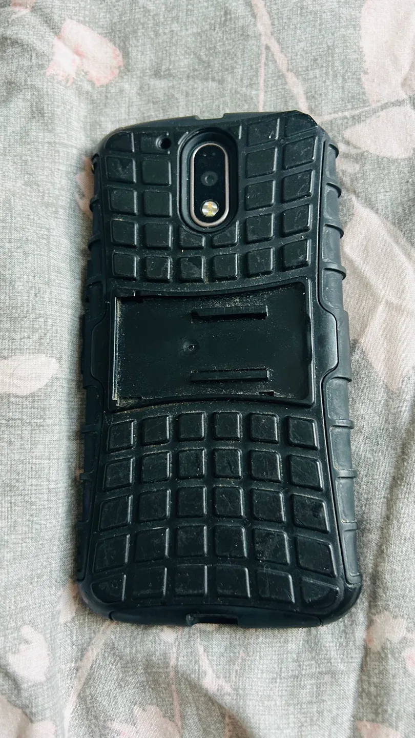 Black Motorola Moto G+ with screen in protective case thumbnail