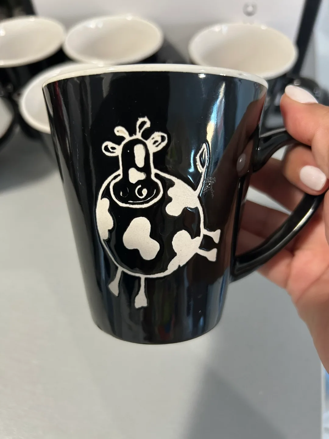 Set of six black mugs with cow design image indicator(2)