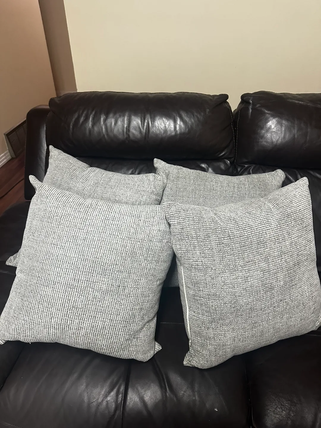 Set of four grey textured throw pillows thumbnail